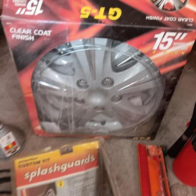 Automobile items - Jumper cables- new mud flaps -Good fire extinguisher wheel covers and more