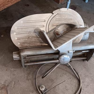 Industrial metal electric meat or cheese slicer