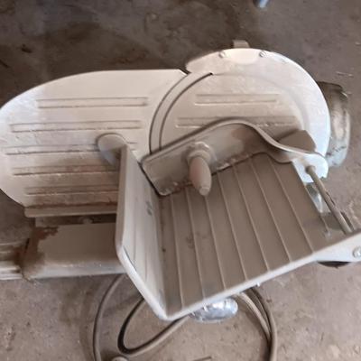 Industrial metal electric meat or cheese slicer