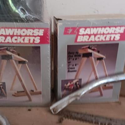 Two new sawhorse brackets and some hand saws and leather tool pouch