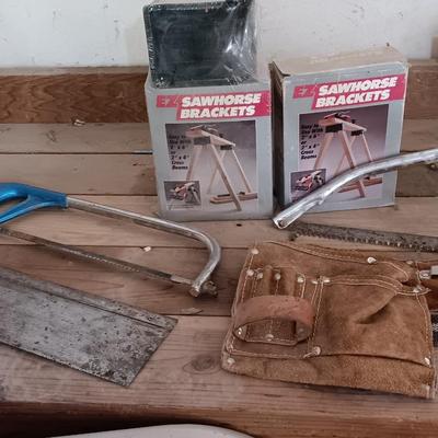 Two new sawhorse brackets and some hand saws and leather tool pouch