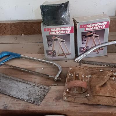 Two new sawhorse brackets and some hand saws and leather tool pouch