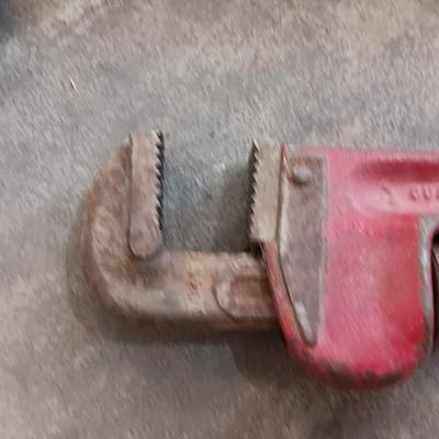 Assortment of hammers for different uses and a pipe wrench