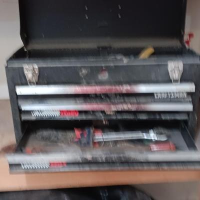 Old Craftsman toolbox with an assortment of tools