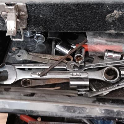 Old Craftsman toolbox with an assortment of tools