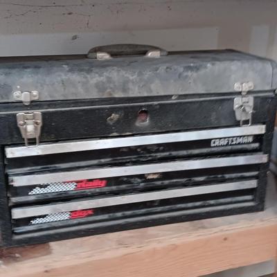 Old Craftsman toolbox with an assortment of tools