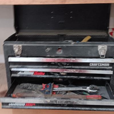 Old Craftsman toolbox with an assortment of tools