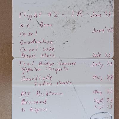 Six metal slide boxes full of slides from various travels