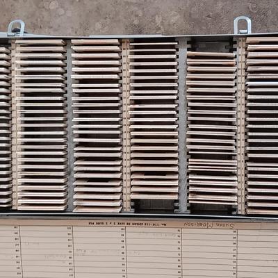 Six metal slide boxes full of slides from various travels