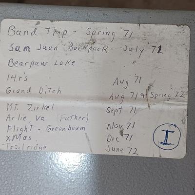 Six metal slide boxes full of slides from various travels