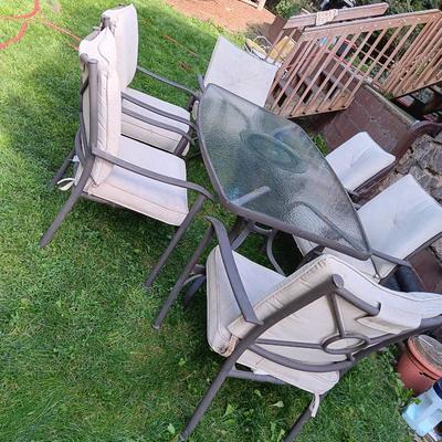 Patio set with table, six chairs and umbrella