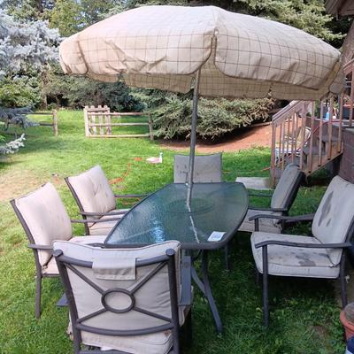 Patio set with table, six chairs and umbrella