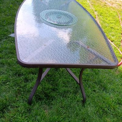 Patio set with table, six chairs and umbrella