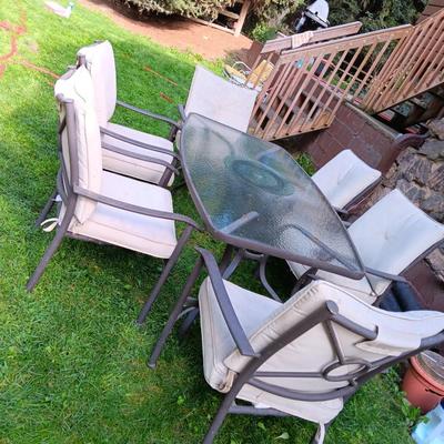 Patio set with table, six chairs and umbrella