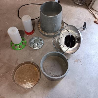 Chicken feeders and a heat lamp