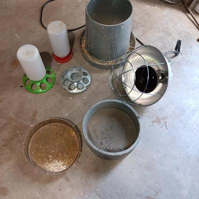Chicken feeders and a heat lamp