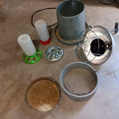 Chicken feeders and a heat lamp
