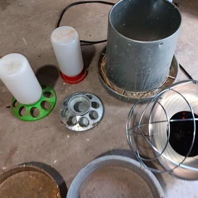 Chicken feeders and a heat lamp