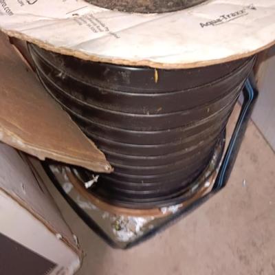 Roll of Toro Aqua-Traxx with the PBX Advantage Drip tape with small box of plumbing supplies