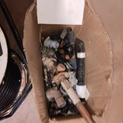 Roll of Toro Aqua-Traxx with the PBX Advantage Drip tape with small box of plumbing supplies