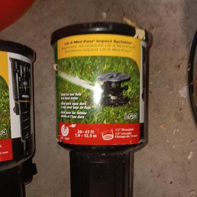 Home Depot bucket with new Rain bird sprinkler heads 1/4" Polyethylene tubing and misc. plumbing supplies