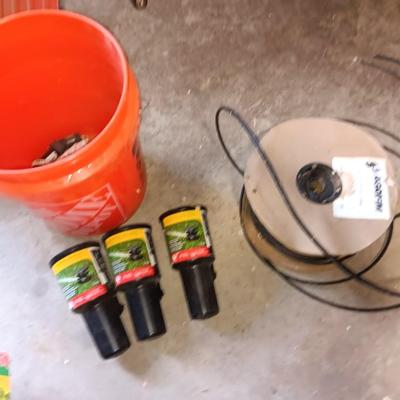 Home Depot bucket with new Rain bird sprinkler heads 1/4" Polyethylene tubing and misc. plumbing supplies