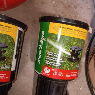 Home Depot bucket with new Rain bird sprinkler heads 1/4" Polyethylene tubing and misc. plumbing supplies