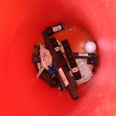 Home Depot bucket with new Rain bird sprinkler heads 1/4" Polyethylene tubing and misc. plumbing supplies