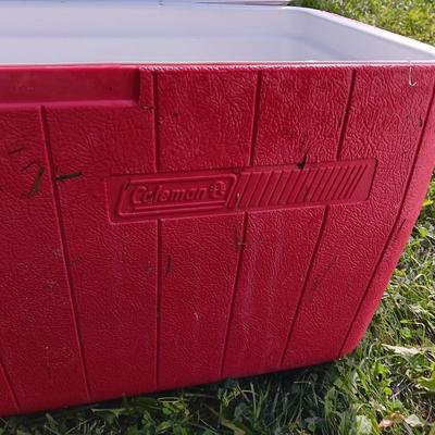 Laid back folding chair with red Coleman cooler
