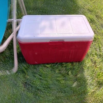 Laid back folding chair with red Coleman cooler