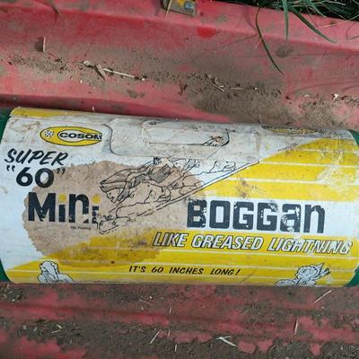 Red dusty sled with vintage mini Boggan like greased lightning! toboggans