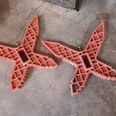 Two hanging butterfly shaped extention cord holders