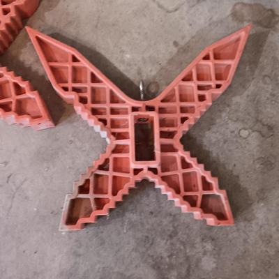 Two hanging butterfly shaped extention cord holders