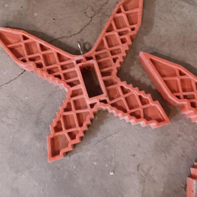 Two hanging butterfly shaped extention cord holders