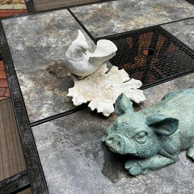 2 pieces of yard art. Resin Pig and a dove