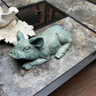 2 pieces of yard art. Resin Pig and a dove