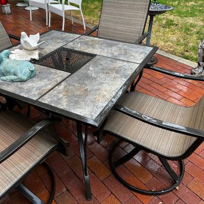 Patio Table with 4 Swivel Chairs. 