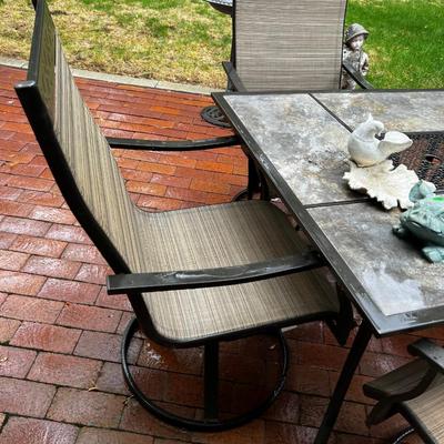 Patio Table with 4 Swivel Chairs. 