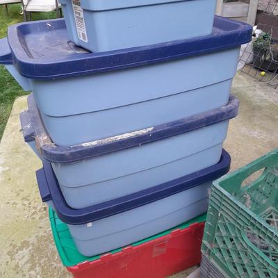 Storage totes with lids, and a few plastic milk crates