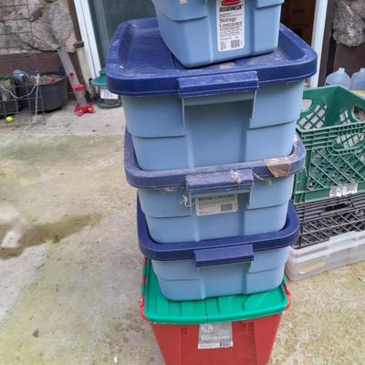 Storage totes with lids, and a few plastic milk crates