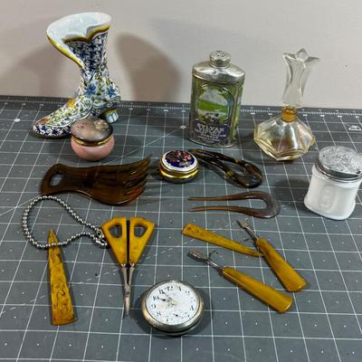 Dresser Top Items: Watch, Talcum Power, Nail Set, Makeup Jars etc.