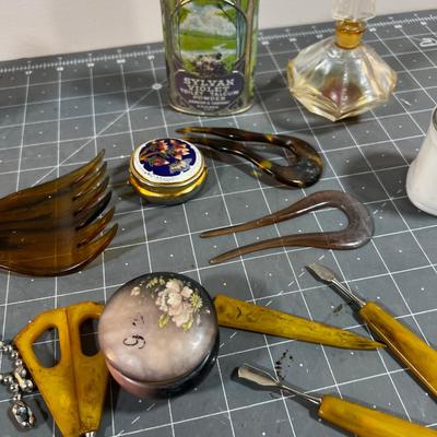 Dresser Top Items: Watch, Talcum Power, Nail Set, Makeup Jars etc.