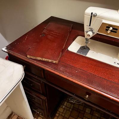B - Singer Sewing Machine in Desk Top Cabinet. 