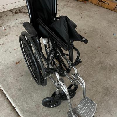GARAGE -- Invacare Wheel Chair. 