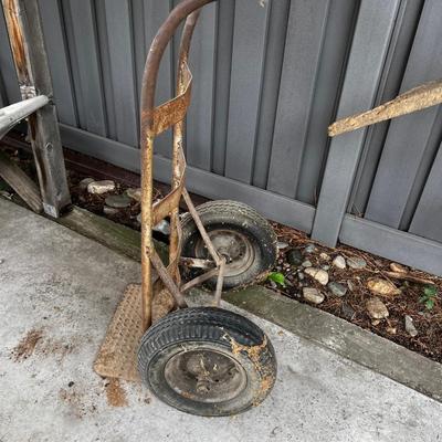 Behind GARAGE -- rubbered tire cart 