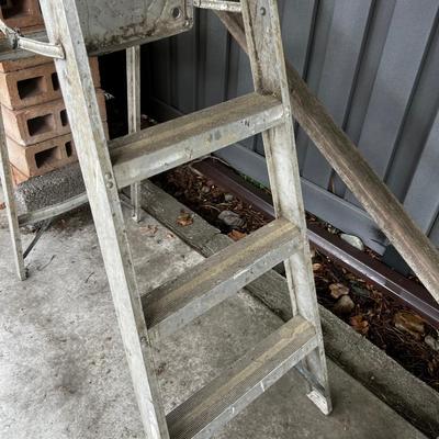 Behind GARAGE -- 6 foot folding step ladder