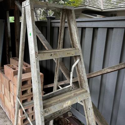 Behind GARAGE -- 6 foot folding step ladder