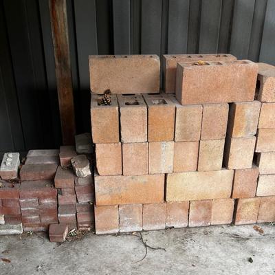 Behind GARAGE -- pile of block and brick used 