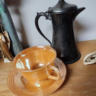 Tea cup and metal pot