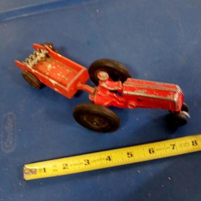 LOT 121 OLD METAL TOY TRACTOR AND MANURE SPREADER